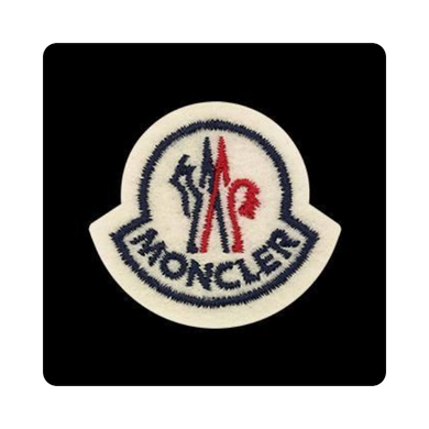 Moncler logo patch on a black background